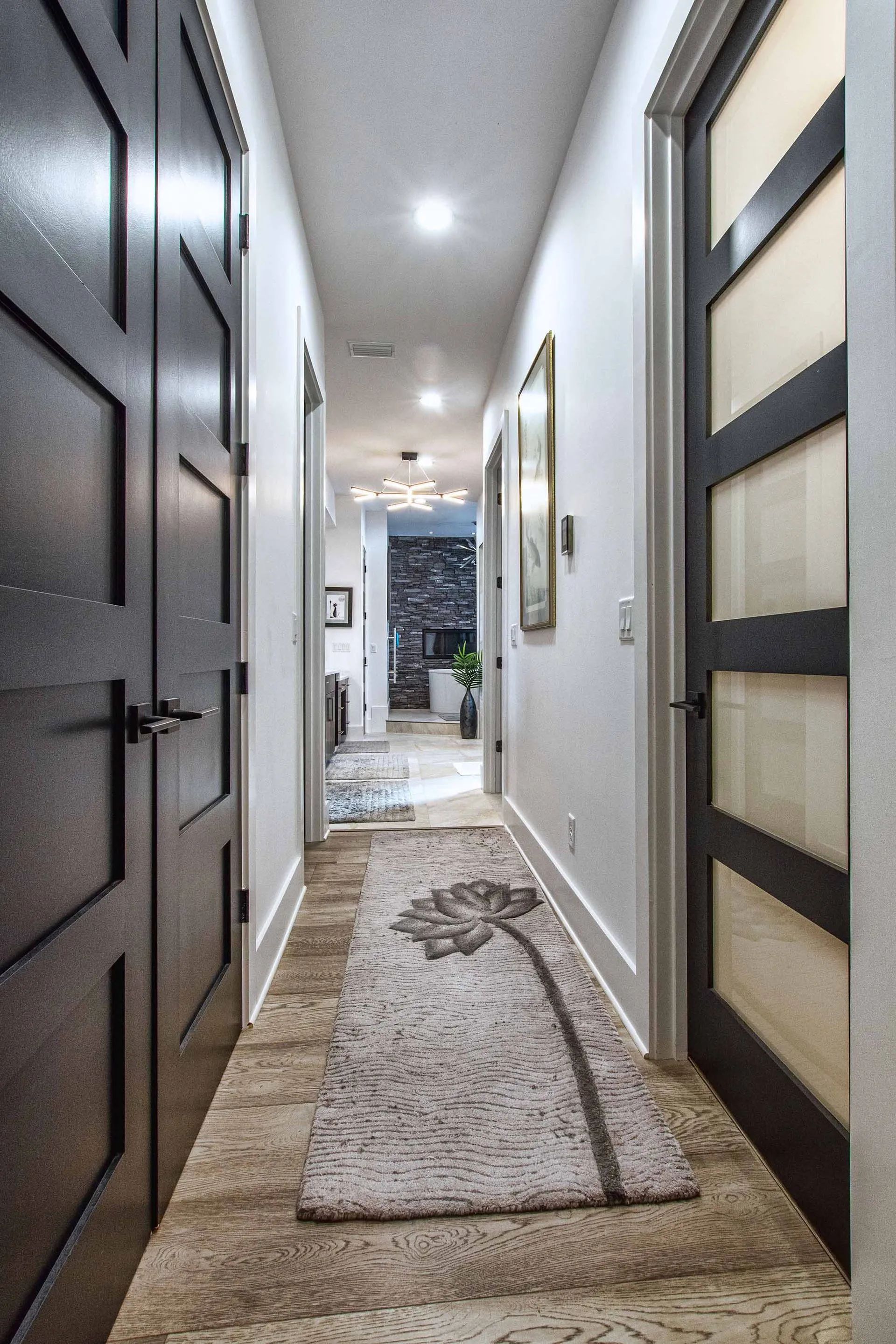 Custom home grand entry hall with wood floors
